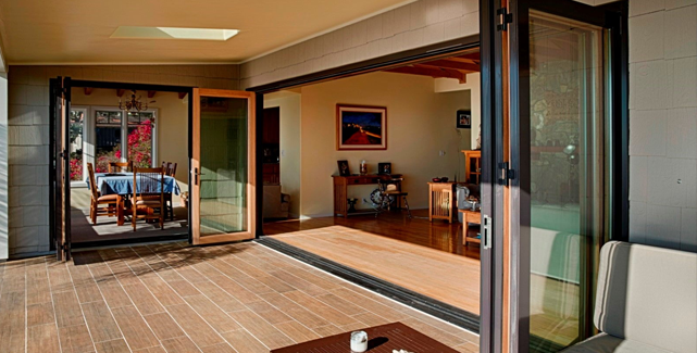 Elegant bi-fold patio doors opening to a garden, enhancing indoor-outdoor flow in an Orange County home.